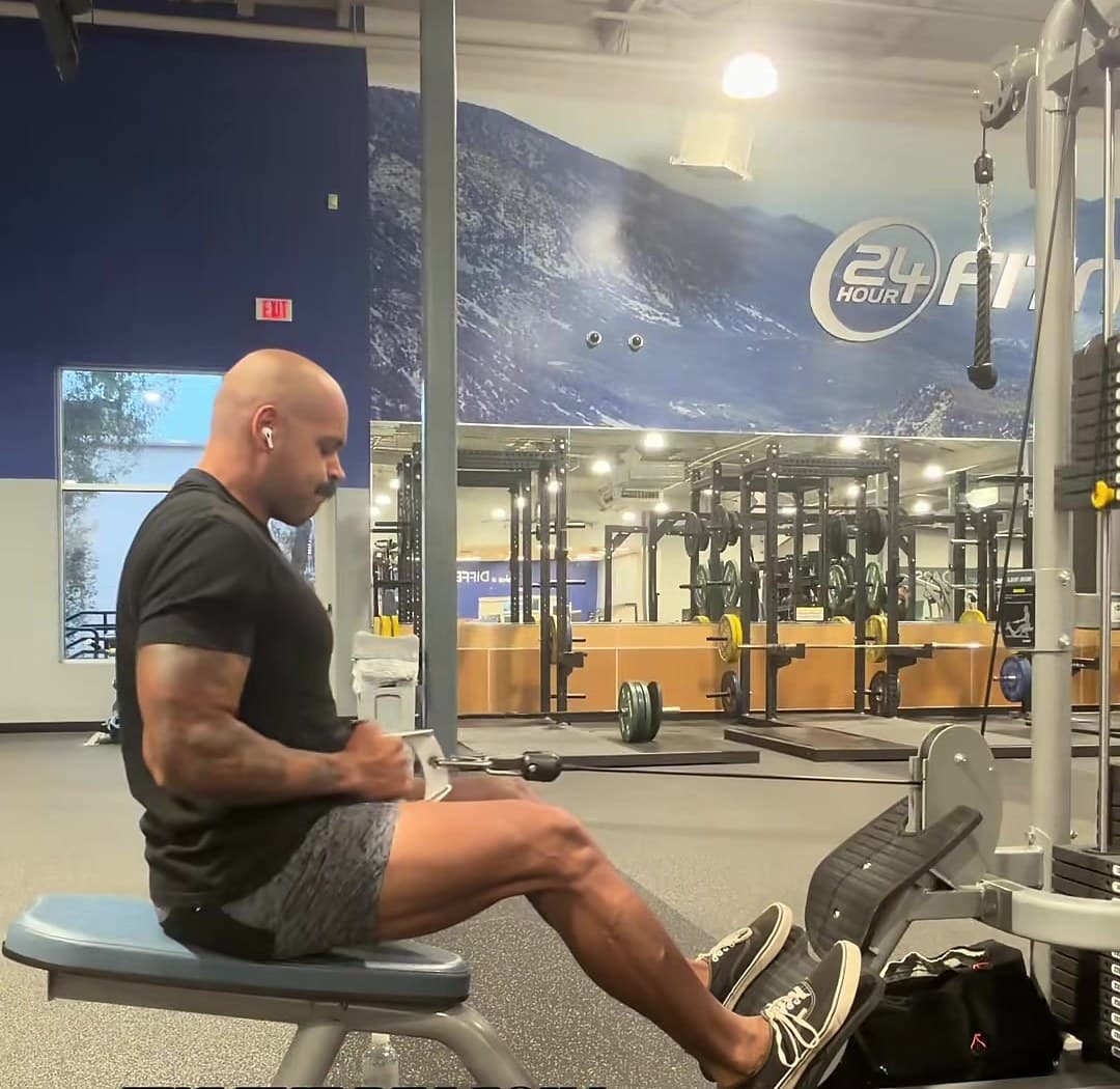 Kody on a seated cable row in a big-box gym.